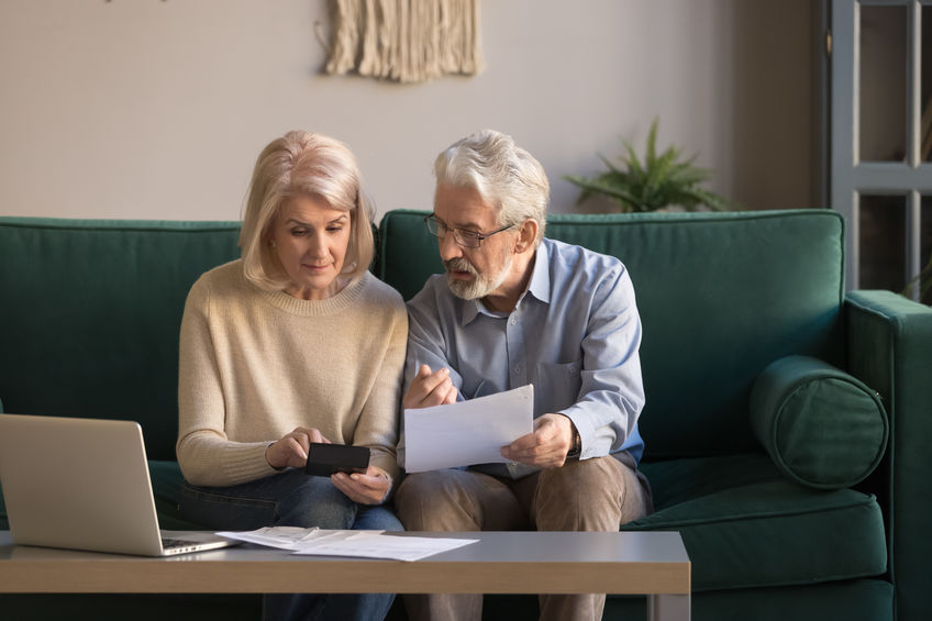 Older COuple Looking at Bills