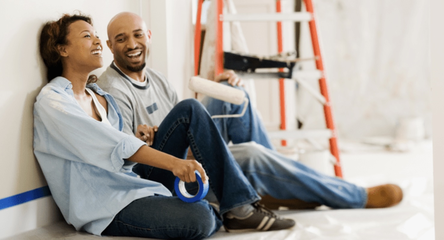 Young Couple Painting Home